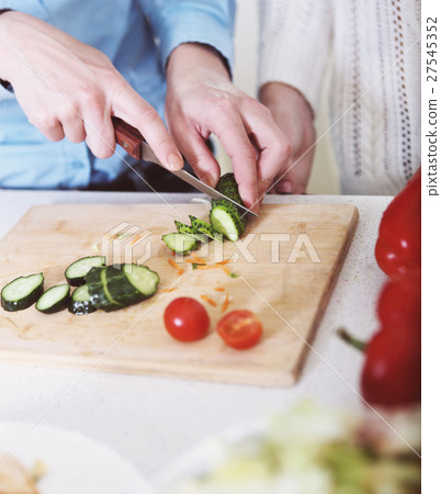 Woman cooking vegetables salad 27545352
