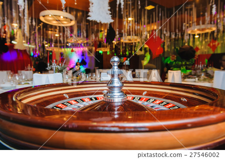Roulette wheel in casino Roulette wheel in casino 27546002