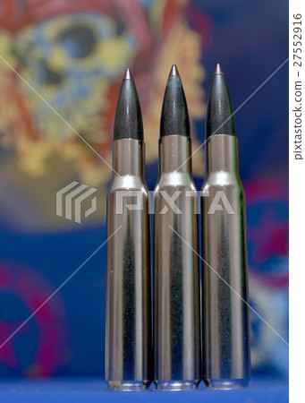 Bullets and skull background 27552916