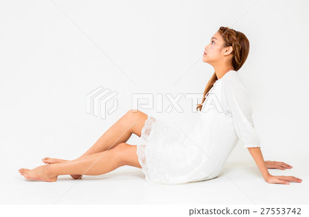 A girl sitting on the floor 27553742