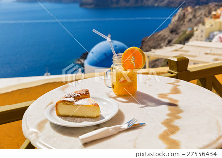 Orange juice and cheesecake 27556434
