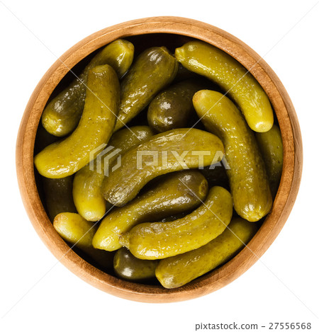 Cornichons, pickled cucumbers in wooden bowl 27556568