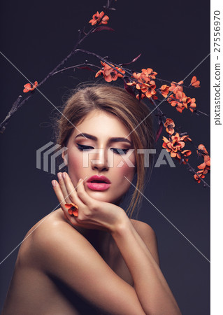 Beautiful girl with sakura branch 27556970
