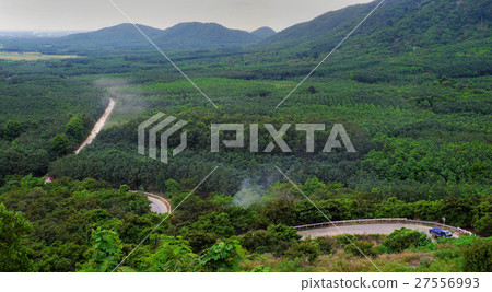 dust road through green  jungle at Vietnam 27556993