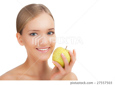 Smiling beauty woman holding green apple while 27557503