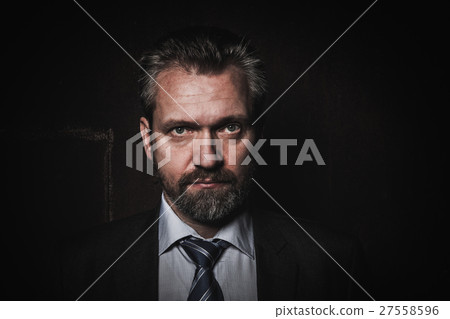Portrait of a mature businessman on black Portrait of a mature businessman on black 27558596