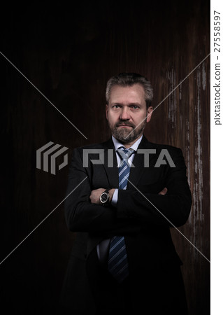 Portrait of a mature businessman on black Portrait of a mature businessman on black 27558597