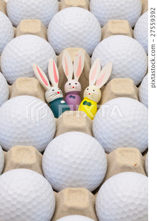 Golf balls in the box for eggs and Easter rabbits Golf balls in the box for eggs and Easter rabbits 27559392