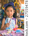 Cute asian girl show her paint brush. 27559478