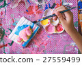 Little hands of kid painting on the plaster statue 27559499
