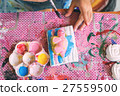 kid painting on the plaster statue, 27559500