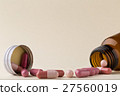 Bottle of pills from the brown glass and colorful 27560019