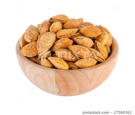 almonds in wood bowl isolated on white background 27560361