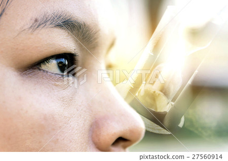 close-up eye of asian women on hourglass close-up eye of asian women on hourglass 27560914