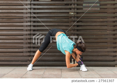 Sporty beautiful young woman practicing yoga doing Sporty beautiful young woman practicing yoga doing 27561307