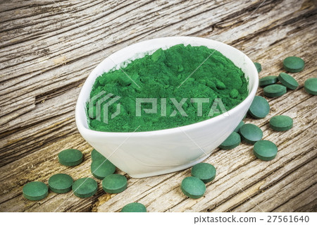 Spirulina,chlorella supplement powder and pills on 27561640