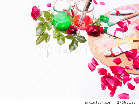 Paints and brushes with rose petals 27562183