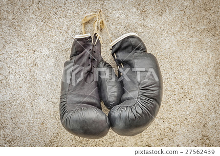 Vintage boxing gloves on wall 27562439