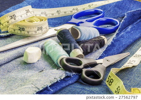 Threads with needles, scissors, and tape measure o 27562797