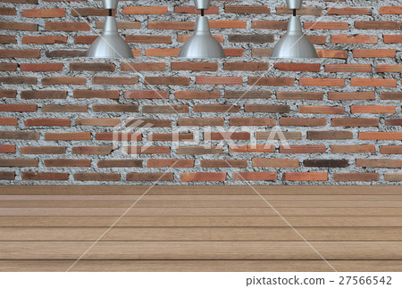 Silver lamps on the ceiling and a backdrop on a brick wall with brown wood floor. Silver lamps on the ceiling and a backdrop on a brick wall with brown wood floor. 27566542