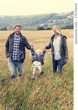 Family Parents Holding Hands Boy Swinging Concept Family Parents Holding Hands Boy Swinging Concept 27570029