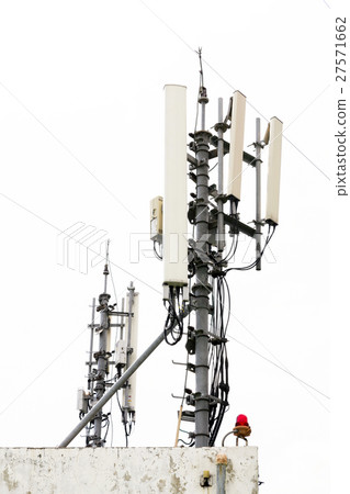 Mobile phone transmission pole on top of building Mobile phone transmission pole on top of building 27571662