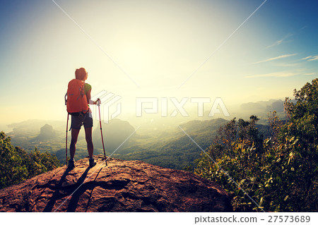 young travele onmountain peak observing locality 27573689
