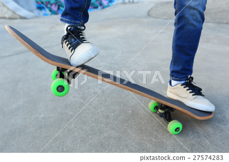 legs riding skateboard at skatepark 27574283