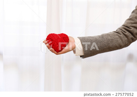 Heart and female hands 27577052