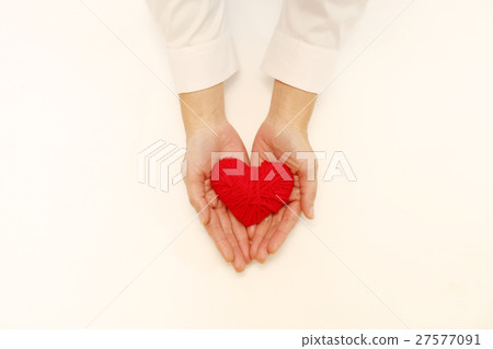 Heart and female hands 27577091