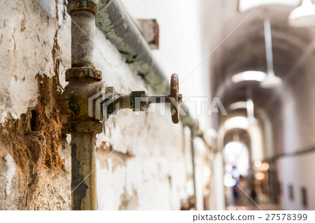 Rusty water pipes of old prison. 27578399