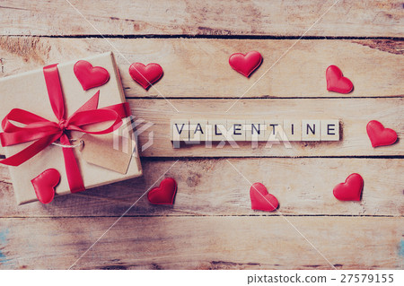 Gift box and red heart with wooden text Valentine Gift box and red heart with wooden text Valentine 27579155