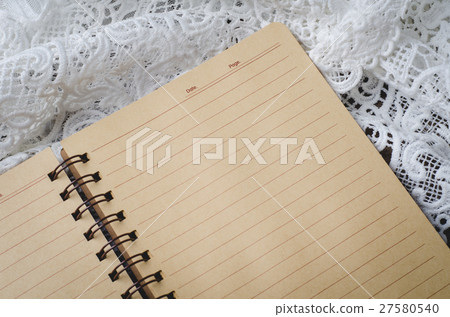 Blank notebook with lace on wooden background Blank notebook with lace on wooden background 27580540