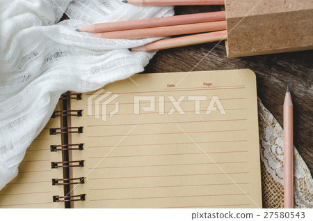 Blank notebook with pencils on wooden background 27580543