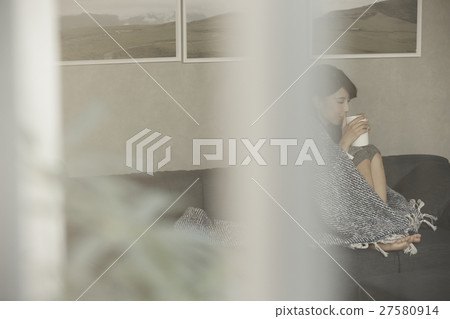 A woman relaxing on the sofa 27580914