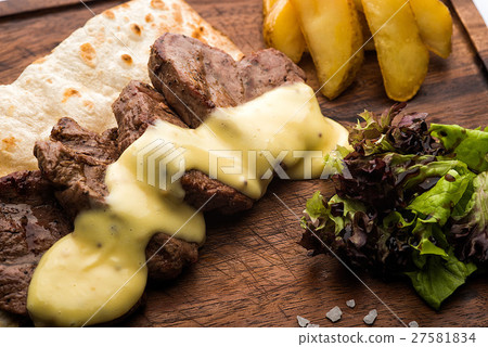 Grilled veal medallions. 27581834