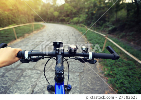 riding mountain bike on forest trail riding mountain bike on forest trail 27582623
