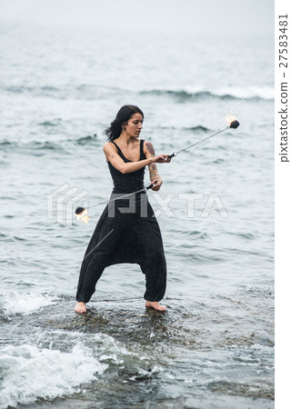 fire show on the shore of the sea 27583481