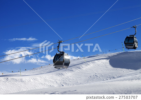 Gondola lifts on ski resort at sun wind day 27583707