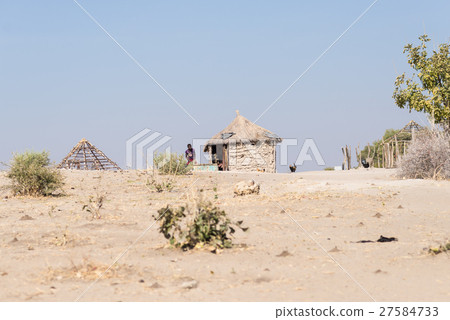 Mud straw and wooden hut 27584733