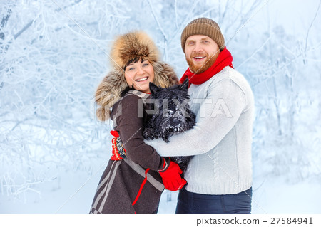 couple with a dog in winter couple with a dog in winter 27584941