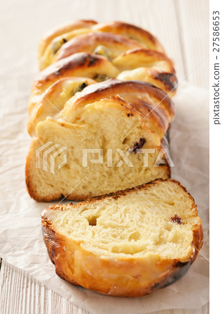 Braided sweet brioche with cheese and cranberries. Braided sweet brioche with cheese and cranberries. 27586653