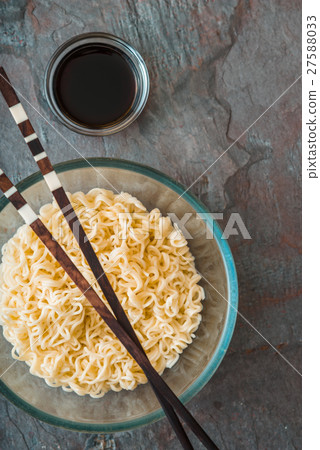 Soup Ramen noodles in glass bowl on tte gray table Soup Ramen noodles in glass bowl on tte gray table 27588033