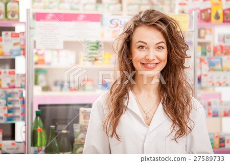 Friendly smiling medical worker in front Friendly smiling medical worker in front 27589733