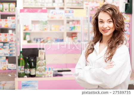Friendly smiling medical worker in front Friendly smiling medical worker in front 27589735