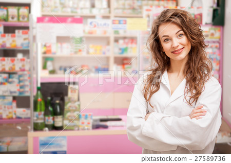 Friendly smiling medical worker in front Friendly smiling medical worker in front 27589736
