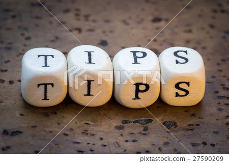 Tips text on wooden cubes  27590209