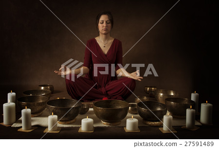 Young woman meditates Young woman meditates 27591489