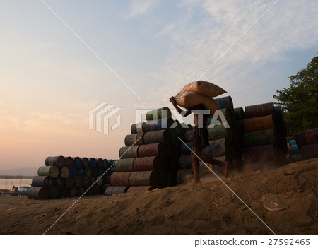 WORKER CARRYING SACKS ON SHOULDER WORKER CARRYING SACKS ON SHOULDER 27592465