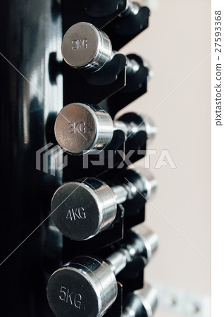 dumbbells in a fitness hall dumbbells in a fitness hall 27593368